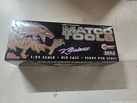 Box of Matco Tools 1:24 scale diecast Chevy Pro Stock model car branded T. Gaines from 2003, adult collectible with artwork of a hawk