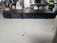 Front view of the Niles SSVC-4 volume control unit showing the front panel with knobs, switches, and input selector.