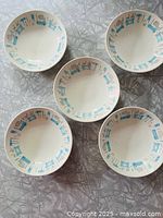 Five matching Royal China Blue Heaven bowls arranged on surface