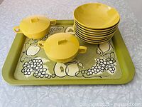 Tray and bowls grouped on surface