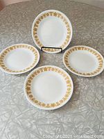 Four plates displayed showing pattern and sizes