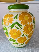 Full view of lamp body showing floral decoration and proportions