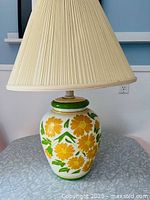 Full view of ceramic floral lamp with shade