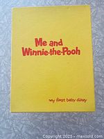 Front of closed baby diary book showing title and illustration