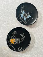 Both black sketch plates front view