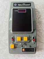 Front view showing full handheld game layout