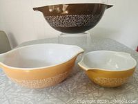 Three Woodland Brown bowls in graduated sizes on table