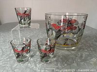 Group image of ice bucket and three shot glasses showing pattern