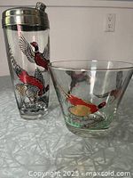 Ice bucket and cocktail shaker showing matching pheasant design