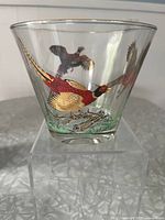 Front view showing a red and gold Ring Neck Pheasant in flight painted on clear glass ice bucket.