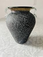 Front view of the Raku glass vase showing the textured black and white crackled surface and clear glass handles.