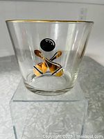 Clear glass ice bucket with vintage bowling ball and pins graphics and gold rim
