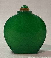 Front view of the green jade bottle showing shape and stopper