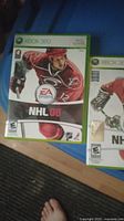 NHL 08 Xbox 360 game case showing cover with ice hockey player in red jersey