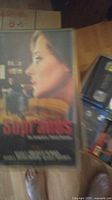 Close-up photo of VHS case featuring artwork from The Sopranos series with a woman's profile alongside a man in the background.