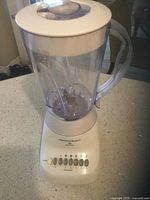 Photo of Hamilton Beach 10 Speed White Countertop Blender showing entire blender unit with plastic pitcher, control panel, and top lid.