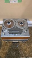 Top front view of vintage Tandberg reel to reel player showing control panel and reels.