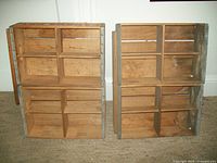 Two pairs of wooden crates stacked in two layers, showing front compartments and wood grain.