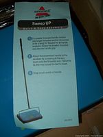 Instruction sheet indicating easy assembly steps for the Bissell Sweep Up sweeper, including fitting threaded handle sections and snapping on the brush comb.