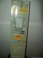 Front view of boxed Achim Cordless Mini-Blinds package showing brand, child safe feature and dimensions.
