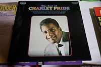 Album cover of 'The Best of Charley Pride' by RCA Victor showing portrait of Charley Pride in a suit.