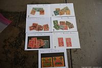 Seven stock cards each containing several vintage USA postage stamps from 1860s and up, displayed laid flat in groups of 6 cards with one partially shown below.