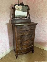 Front view of dresser with mirror