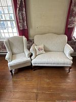Loveseat and wingback chair side by side, full front view