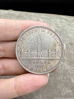 Reverse side of coin showing Parliament buildings and inscriptions including date 1939