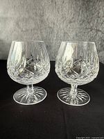 Front view of both snifters showing overall shape and cut pattern