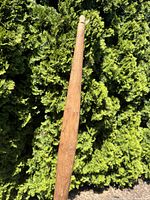 Detailed view of tapered tip of the cedar bow.