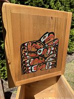 Open top view showing underside of lid painted with eagle motif and interior of box