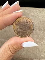 Reverse of coin showing the Prince Edward Island seal with two oak trees and inscription 'ONE CENT'.