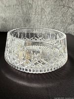 angled view of the round crystal bowl centrepiece showing the cut detail pattern on the sides and base