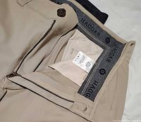 Close-up photo of beige Docker style pants by Haggar showing zipper and interior waistband label
