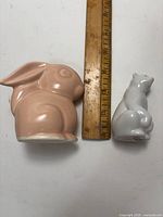 Photo showing pink bunny and white polar bear figurines with ruler for size reference