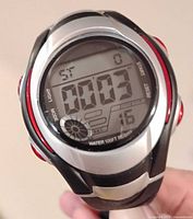 Front view of men's digital sports quartz watch, showing display on with stopwatch mode and time reading.