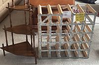 Photo showing wooden 3-tier corner shelf and wooden wine rack side by side on carpeted floor.