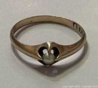 Full view of gold ring front showing pearl