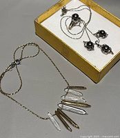 Both necklaces and earrings in display box