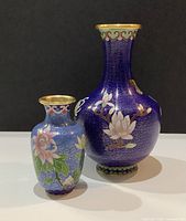 Both vases front view showcasing size difference and designs