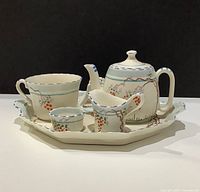 Full view of tea set on tray showing all pieces and decoration