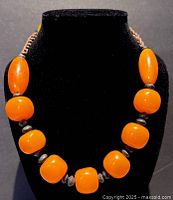 Necklace on display bust showing bead arrangement