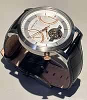 Three-quarter view of watch showing dial and strap