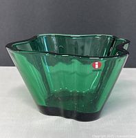 Front view of green Iittala Aalto bowl with sticker visible