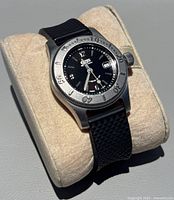 Front angled view showing dial, bezel, crown, strap