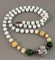 Necklace coiled to show clasp and beads