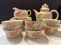 Full lot showing teapot, gravy boat, bowls, plates