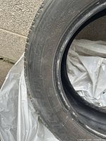 Close view of Michelin tire sidewall showing 215/60R16 size marking and brand name