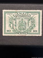 Front view of the 1942 Canada 10 cent Special Delivery stamp showing Coat of Arms and flags.